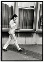 https://www.ed-templeton.com/files/gimgs/th-156_Boy walking Smoking white suit Antwerp.jpg